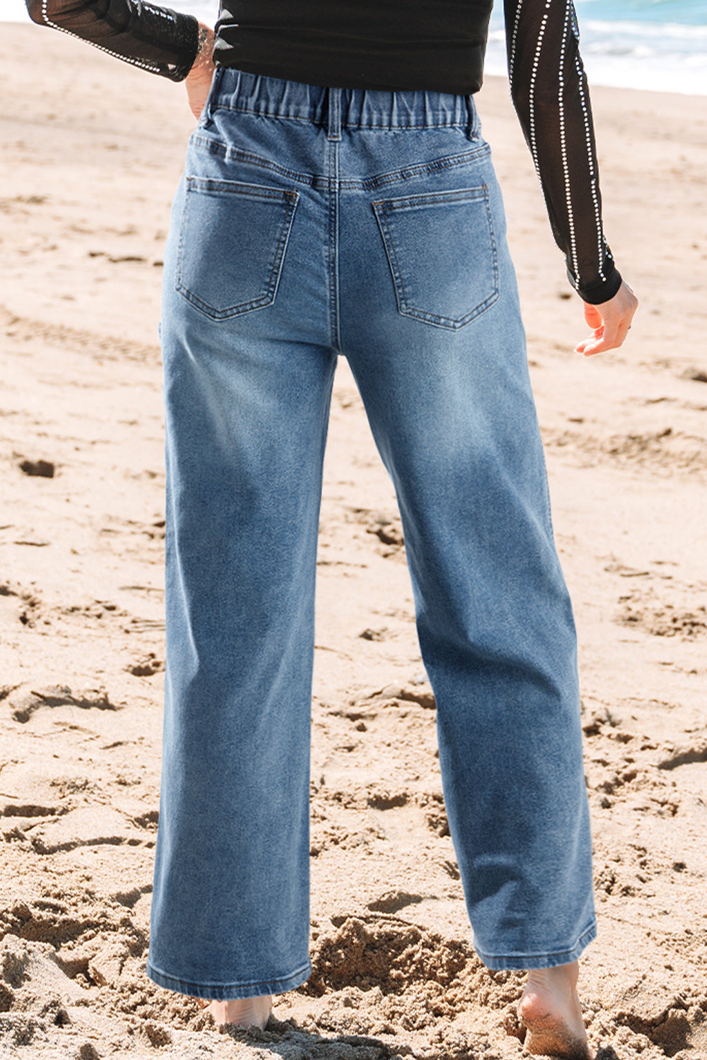 Stone blue star patchwork cropped wide-leg high-waist jeans by Mommas Hive, showcasing detailed patchwork and relaxed fit.