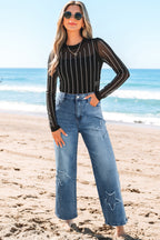 Stone blue star patchwork cropped wide-leg high waist jeans by Mommas Hive, showcasing distressed detail and relaxed fit.