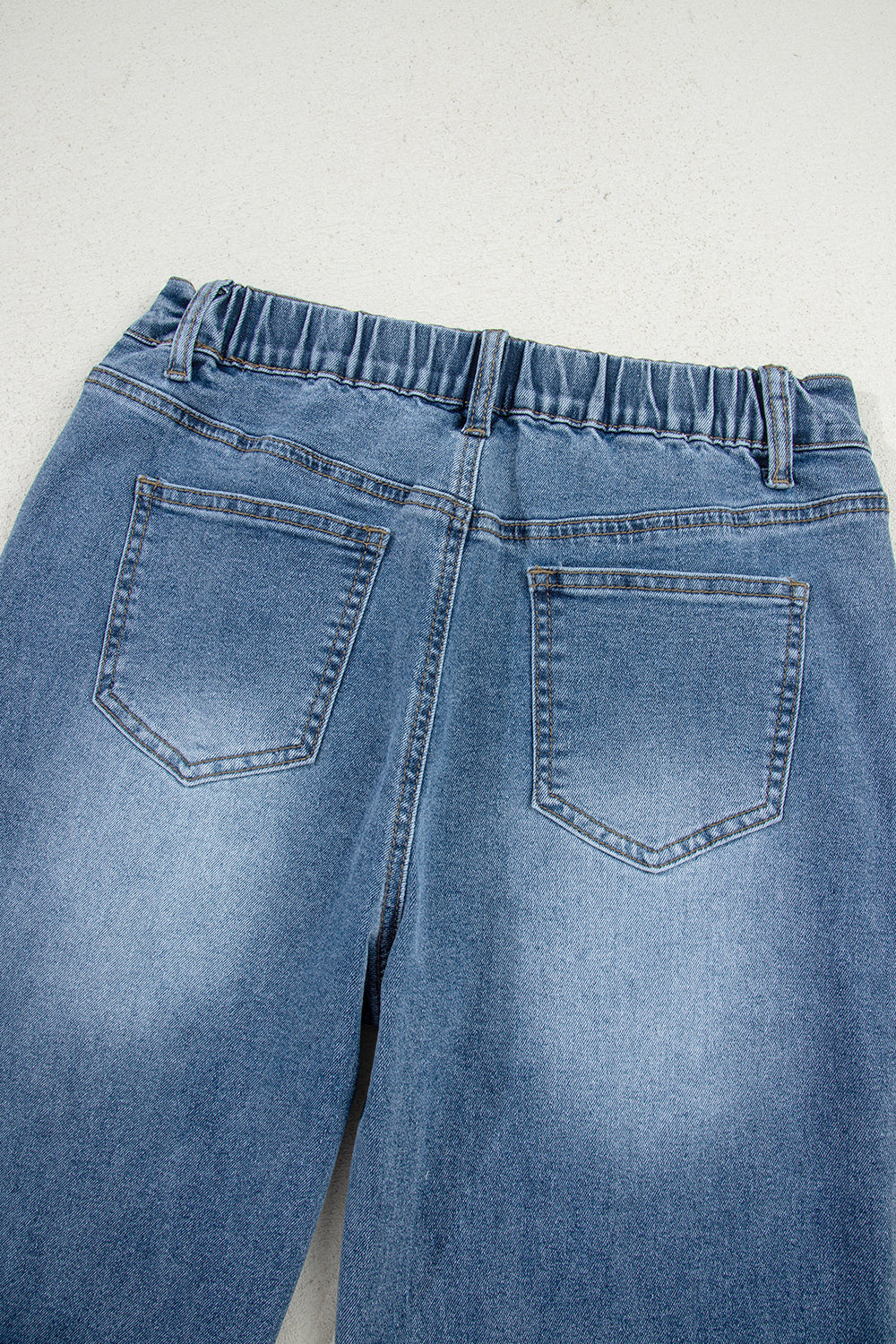 Stone blue star patchwork cropped wide-leg high-waist jeans from Mommas Hive, showing distressed details and relaxed fit.