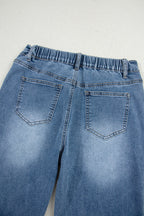 Stone blue star patchwork cropped wide-leg high-waist jeans from Mommas Hive, showing distressed details and relaxed fit.