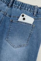 Stone blue star patchwork cropped wide-leg high-waist jeans by Mommas Hive, featuring distressed details and comfortable fit.