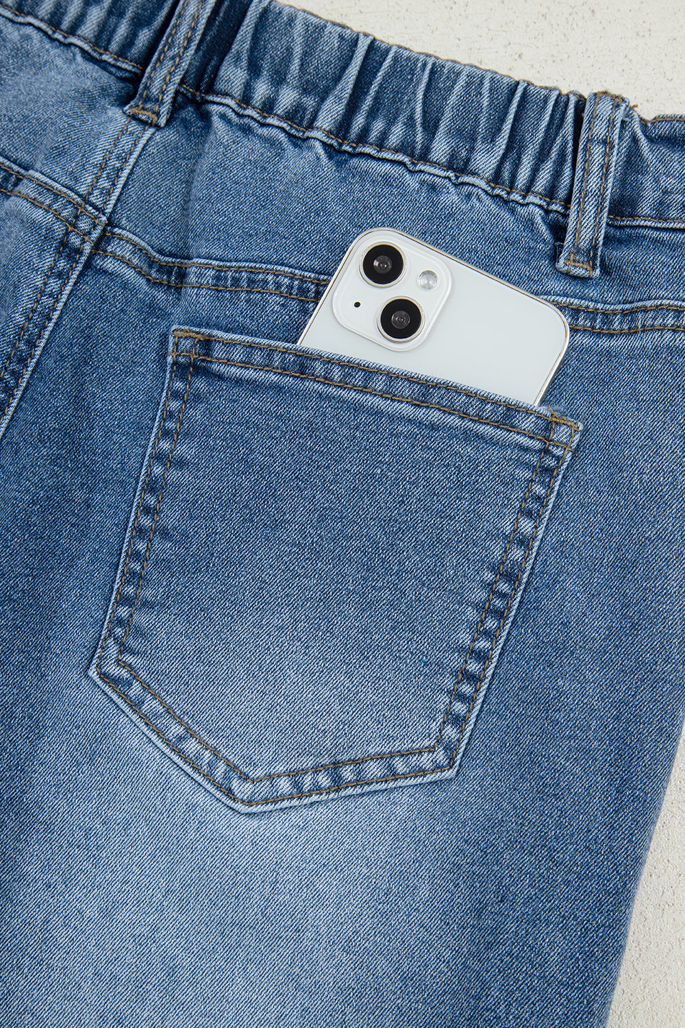 Stone blue star patchwork cropped wide-leg high-waist jeans by Mommas Hive, featuring distressed details and comfortable fit.