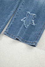Stone blue star patchwork cropped wide-leg high waist jeans by Mommas Hive, showcasing distressed details and relaxed fit.