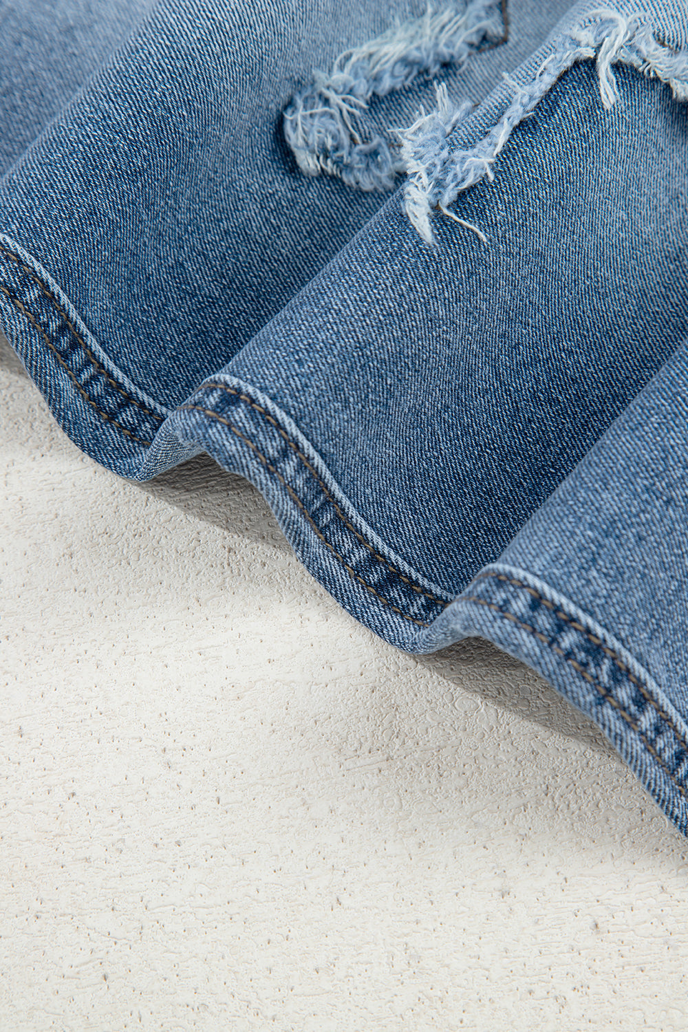 Stone blue star patchwork cropped wide-leg high-waist jeans from Mommas Hive, featuring distressed details and durable denim fabric.