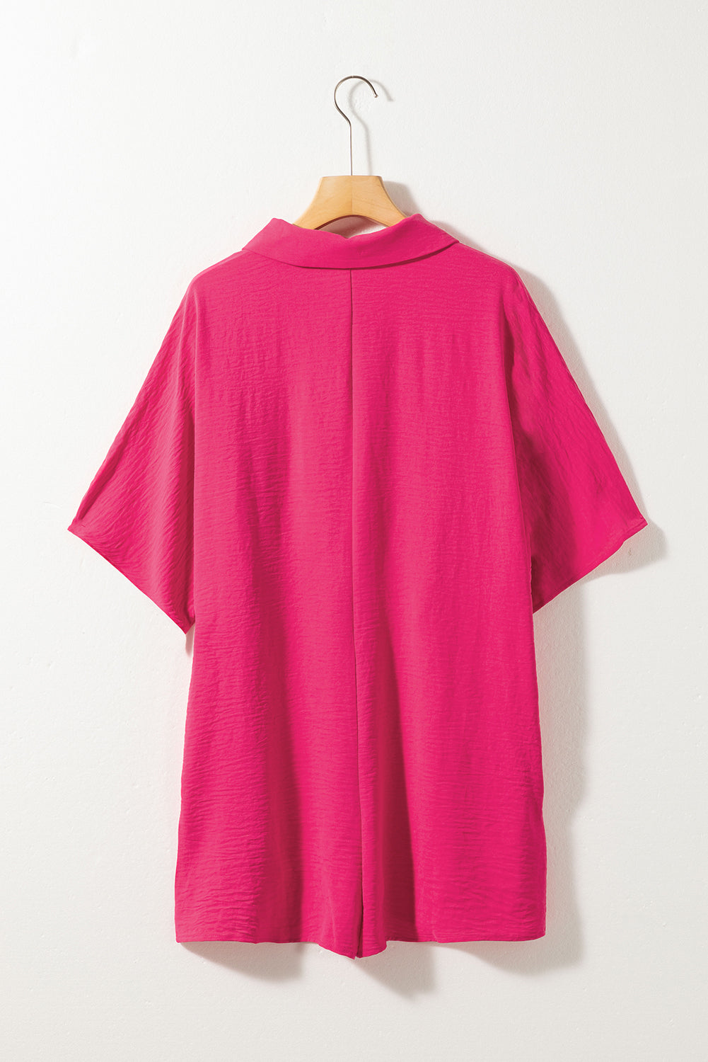 Bright pink Mommas Hive half-button collared loose romper, casual jumpsuit with short sleeves and relaxed fit, made of lightweight polyester.