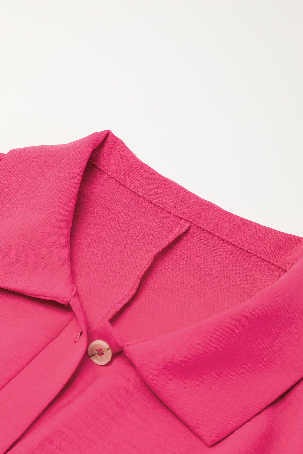 Bright pink Mommas Hive loose romper with half-button collar, made of 100% polyester, featuring a relaxed fit and casual style.