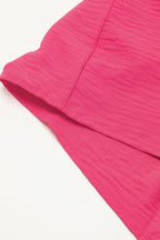 Bright pink Mommas Hive loose romper with half-button collar, made of lightweight polyester, perfect for casual wear.