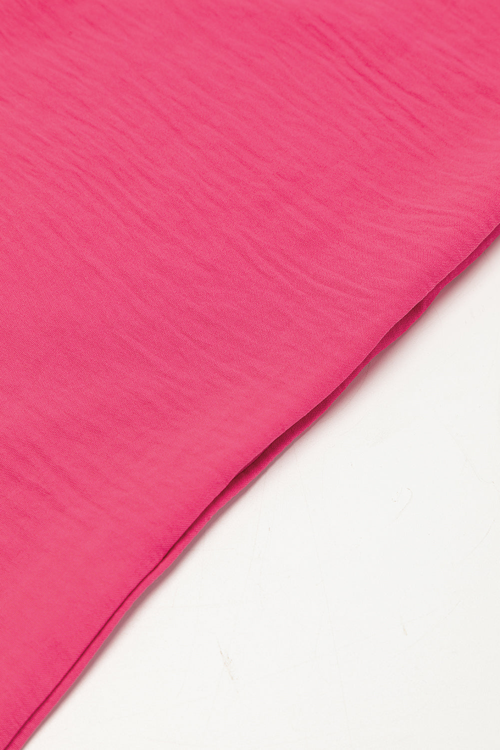 Bright pink Mommas Hive loose romper with half-button collar, made of 100% polyester, featuring a relaxed fit and stylish design.