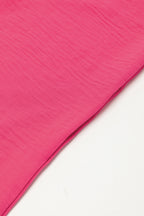 Bright pink Mommas Hive loose romper with half-button collar, made of 100% polyester, featuring a relaxed fit and stylish design.