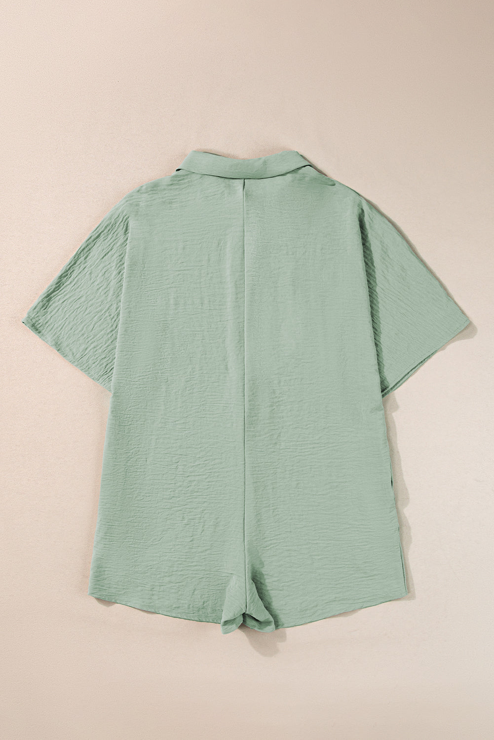 Bright pink Mommas Hive half-button collared loose romper made of 100% polyester, featuring a relaxed fit and stylish design.