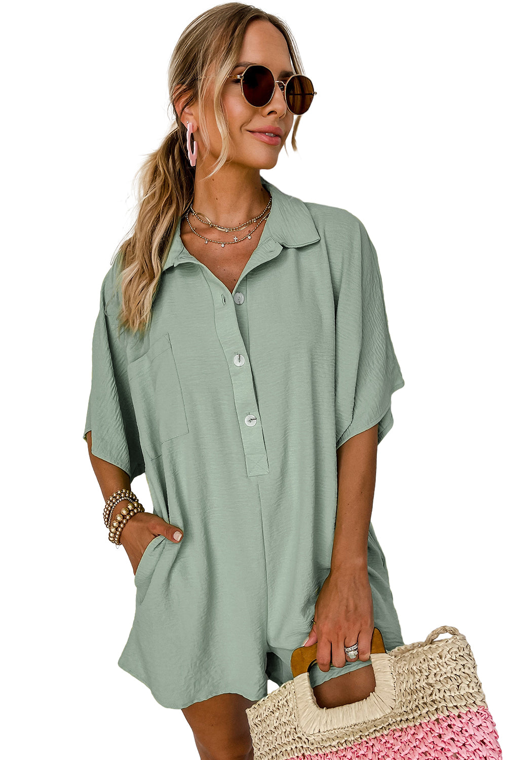 Bright pink Mommas Hive half-button collared loose romper made of 100% polyester, featuring a relaxed fit and stylish design.