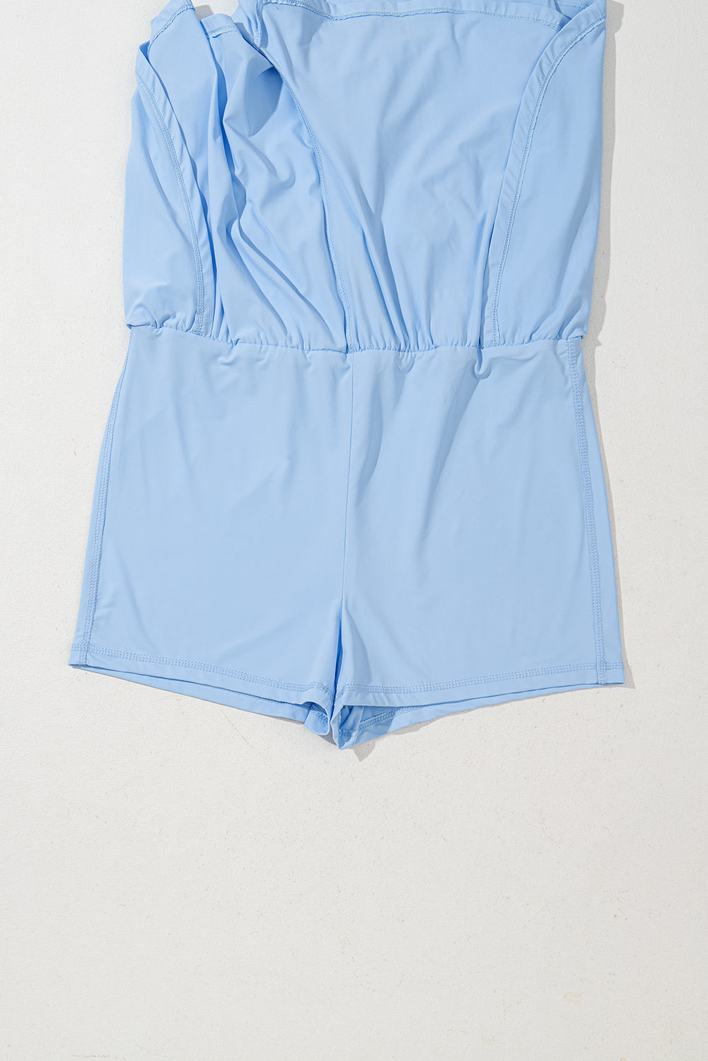 Plain sleeveless romper by Mommas Hive with cinched waist, loop drawstring, made of polyamide and elastane, casual jumpsuit style.