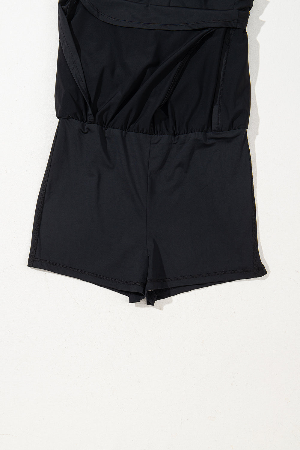 Plain sleeveless romper with drawstring cinched waist by Mommas Hive, made of polyamide and elastane, featuring a simple design.
