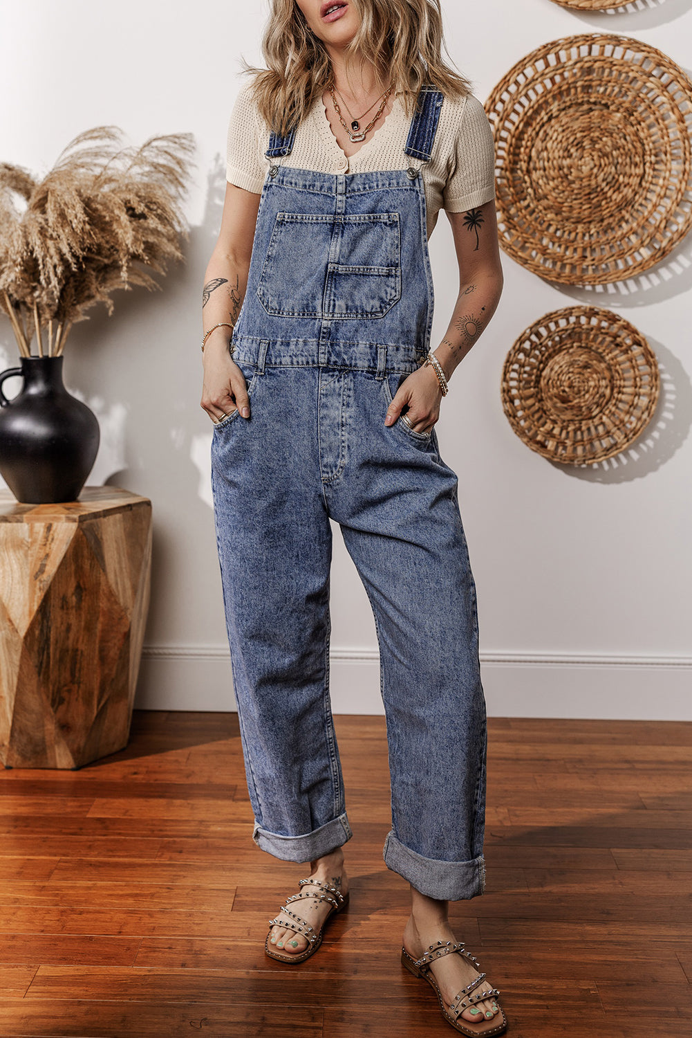 Mommas Hive Sail Blue Denim Bib Jumpsuit with straight legs and front pockets, made of 85% cotton and 15% polyester.