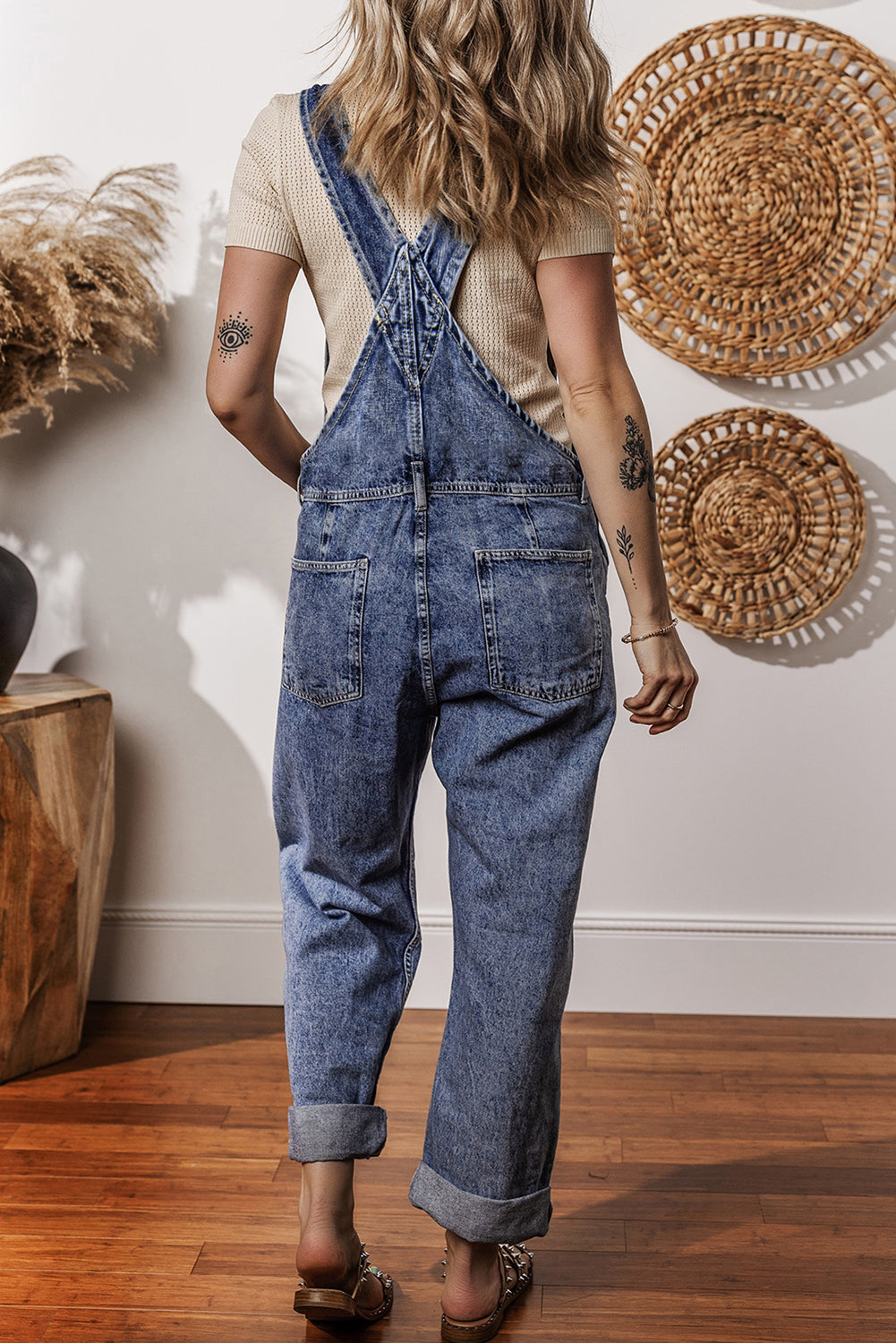 Mommas Hive Sail Blue Denim Bib Jumpsuit with straight legs and pockets, made of cotton-polyester blend, shown flat.