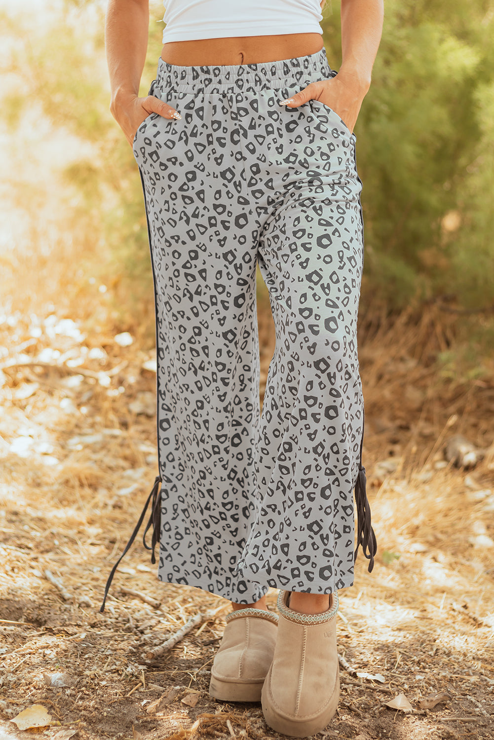 Gray leopard high waist culotte pants by Mommas Hive with side bow, straight-leg design, made of polyester and elastane.