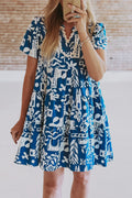 Blue floral loose dress with ricrac trim and split neck from Mommas Hive, made of lightweight polyester fabric.