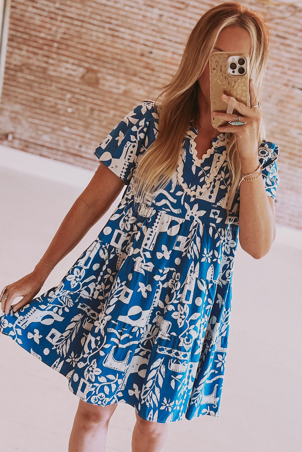 Blue Mommas Hive floral dress with ricrac trim, split neck, loose fit, made from 100% polyester, perfect for casual wear.