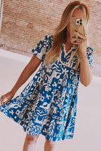 Blue Mommas Hive floral dress with ricrac trim, split neck, loose fit, made from 100% polyester, perfect for casual wear.