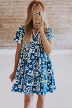 Blue floral dress by Mommas Hive featuring ricrac trim, split neckline, loose fit, and polyester fabric.