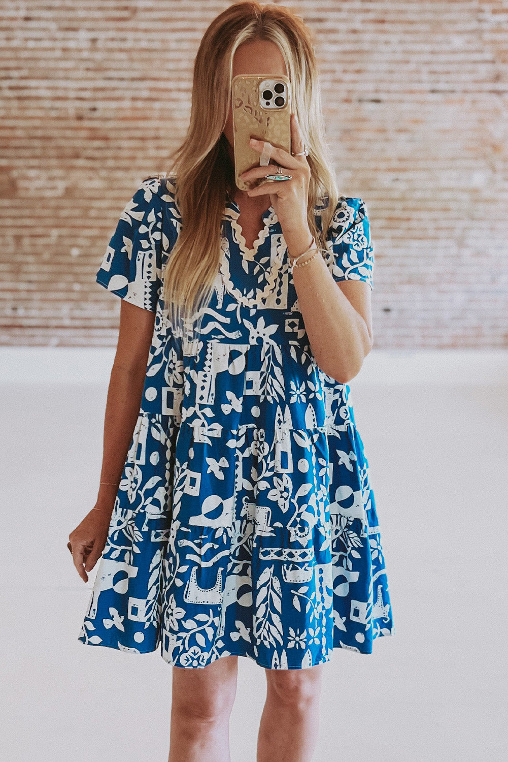 Blue floral dress by Mommas Hive featuring ricrac trim, split neckline, loose fit, and polyester fabric.