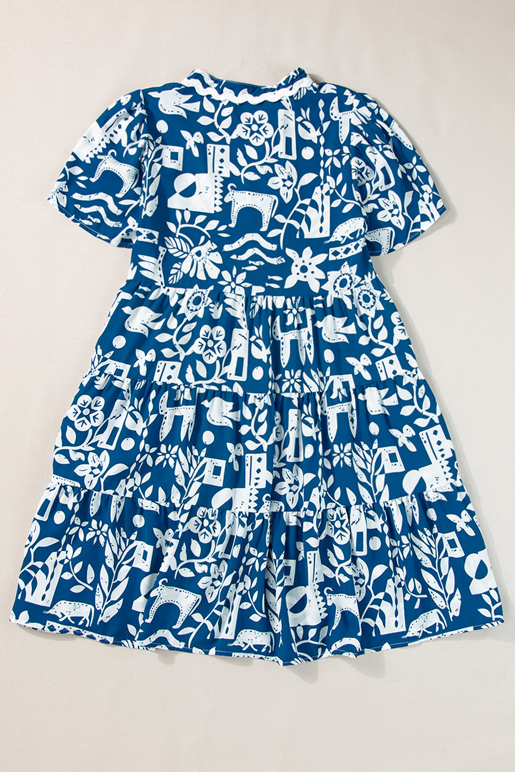 Blue floral loose dress by Mommas Hive with ricrac trim, split neck, and lightweight polyester fabric.