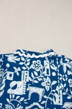 Blue floral loose dress with ricrac trim, split neck, short sleeves, by Mommas Hive, made of lightweight polyester fabric.