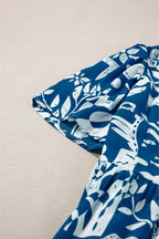 Blue floral dress by Mommas Hive featuring ricrac trim, split neckline, and loose fit in lightweight polyester fabric.