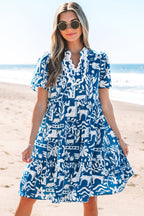 Blue floral dress by Mommas Hive with split neck, ricrac trim, loose fit, and polyester fabric, perfect for casual wear.