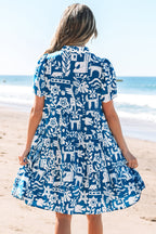 Blue floral loose dress with ricrac trim and split neck by Mommas Hive, featuring a relaxed fit and lightweight polyester fabric.