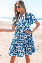 Blue floral loose dress with ricrac trim, split neck, and lightweight polyester fabric by Mommas Hive.