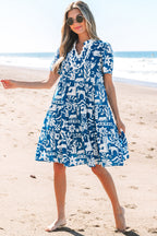 Blue floral dress by Mommas Hive with ricrac trim, split neckline, loose fit, and lightweight polyester fabric.