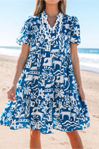 Blue floral loose dress with ricrac trim, split neck, and short sleeves from Mommas Hive, made of lightweight polyester fabric.