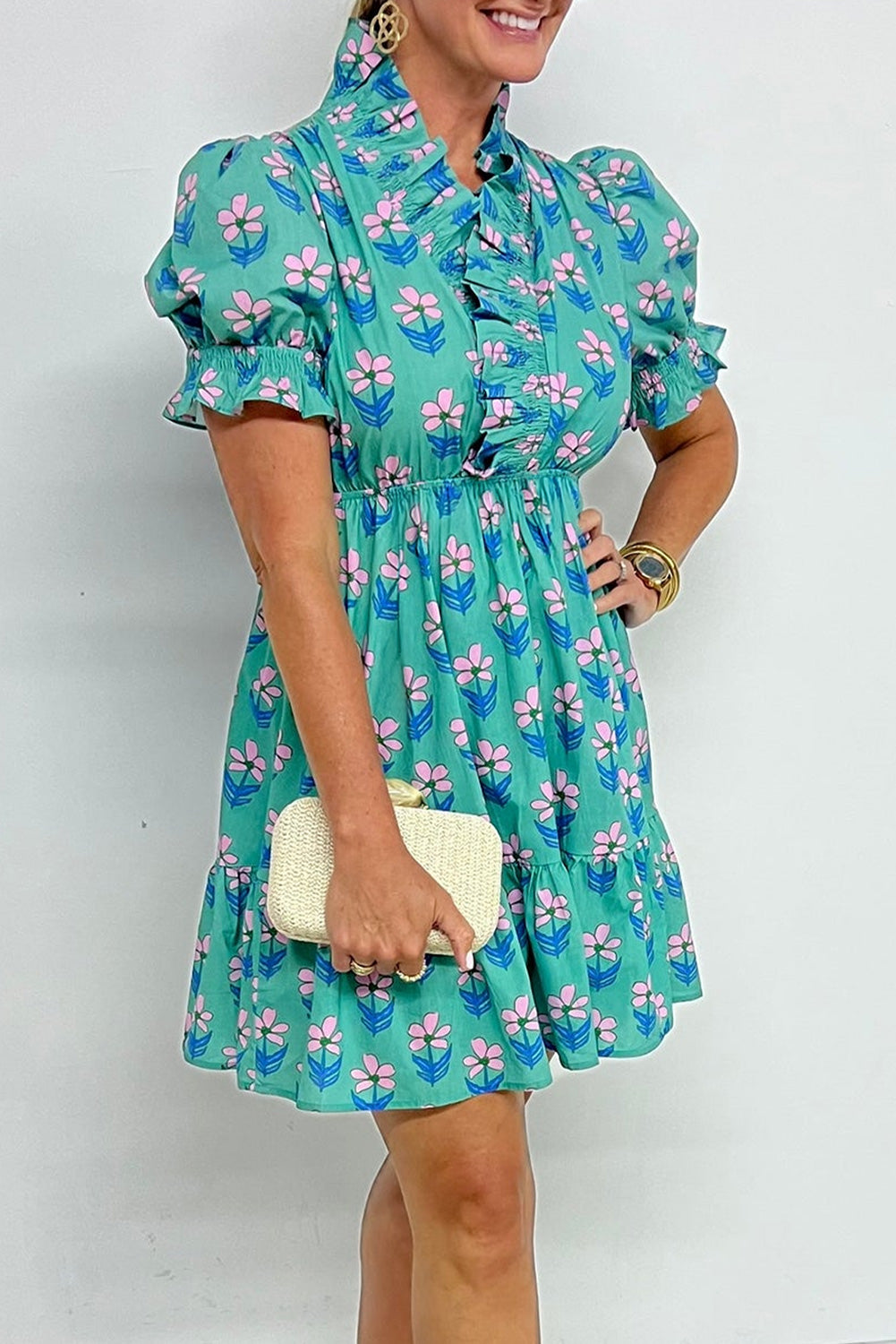 Green floral print mini dress by Mommas Hive featuring frilly details, smocked waist, and high waist design for a stylish look.
