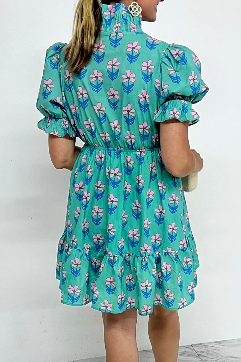 Green floral print high waist mini dress with frilly details and smocked bodice by Mommas Hive, perfect for spring and summer.