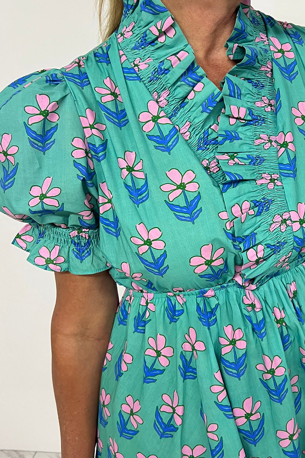 Green floral print mini dress by Mommas Hive featuring frilly details, smocked waist, and high waist design, perfect for casual wear.