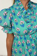 Green floral print mini dress by Mommas Hive featuring frilly details, smocked waist, and high waist design, perfect for casual wear.