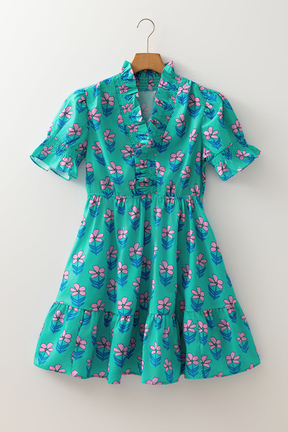 Green floral print high waist mini dress by Mommas Hive with frilly details and smocked bodice, perfect for casual summer wear.