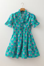 Green floral print high waist mini dress by Mommas Hive with frilly details and smocked bodice, perfect for casual summer wear.