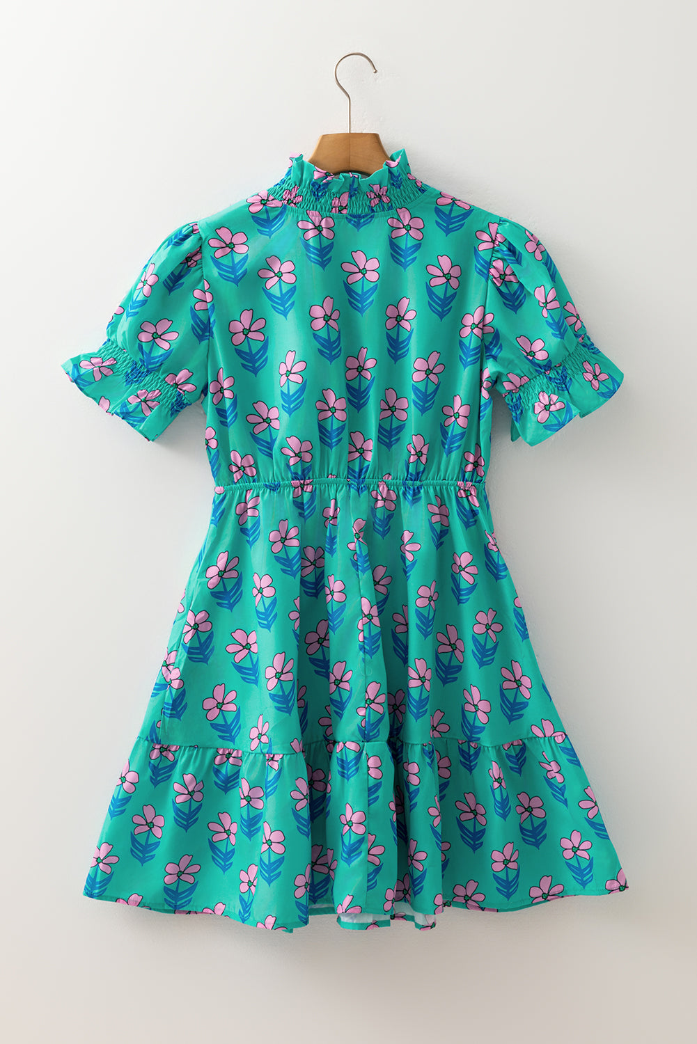 Green floral print high waist mini dress with frilly and smocked details by Mommas Hive, featuring a stylish, summery design.