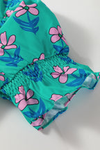 Green floral print mini dress by Mommas Hive with frilly accents, smocked bodice, and high waist for a stylish look.