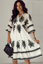 Black Western geometric print midi dress by Mommas Hive with 3/4 sleeves, loose fit, and stylish design.