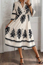 Black Western geometric print midi dress by Mommas Hive with 3/4 sleeves and a loose fit, made from lightweight polyester.