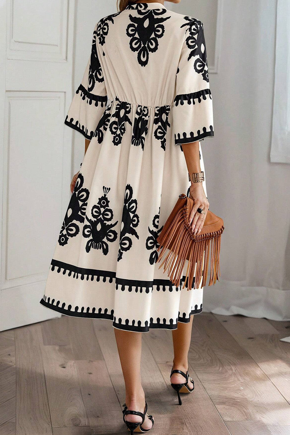 Black Western geometric print midi dress by Mommas Hive with 3/4 sleeves and a loose, flowy fit.