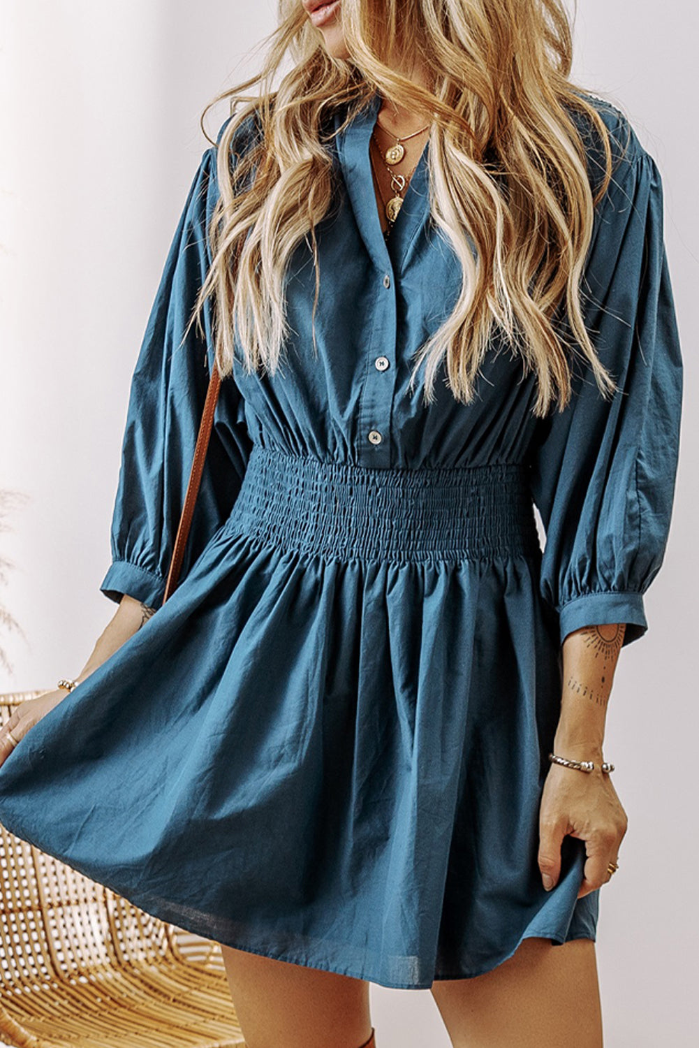 Prussian Blue Mommas Hive mini dress with 3/4 sleeves, shirred high waist, and button details, made of 100% cotton.
