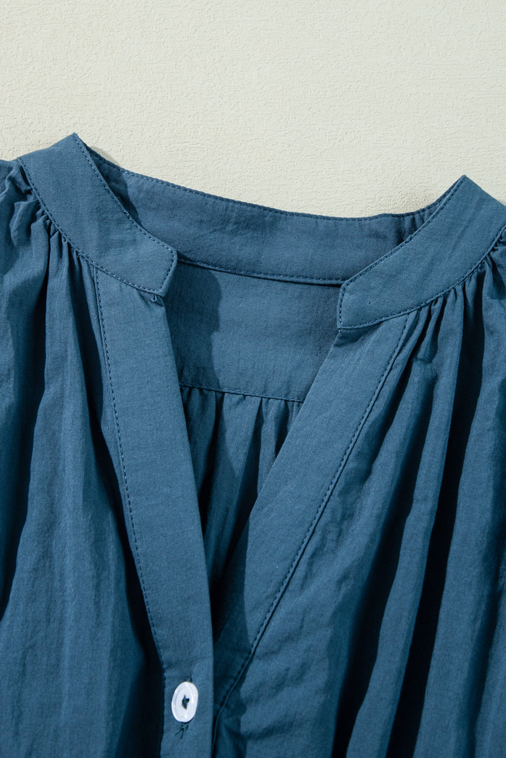 Prussian Blue mini dress by Mommas Hive featuring 3/4 sleeves, shirred high waist, and button details in 100% cotton.