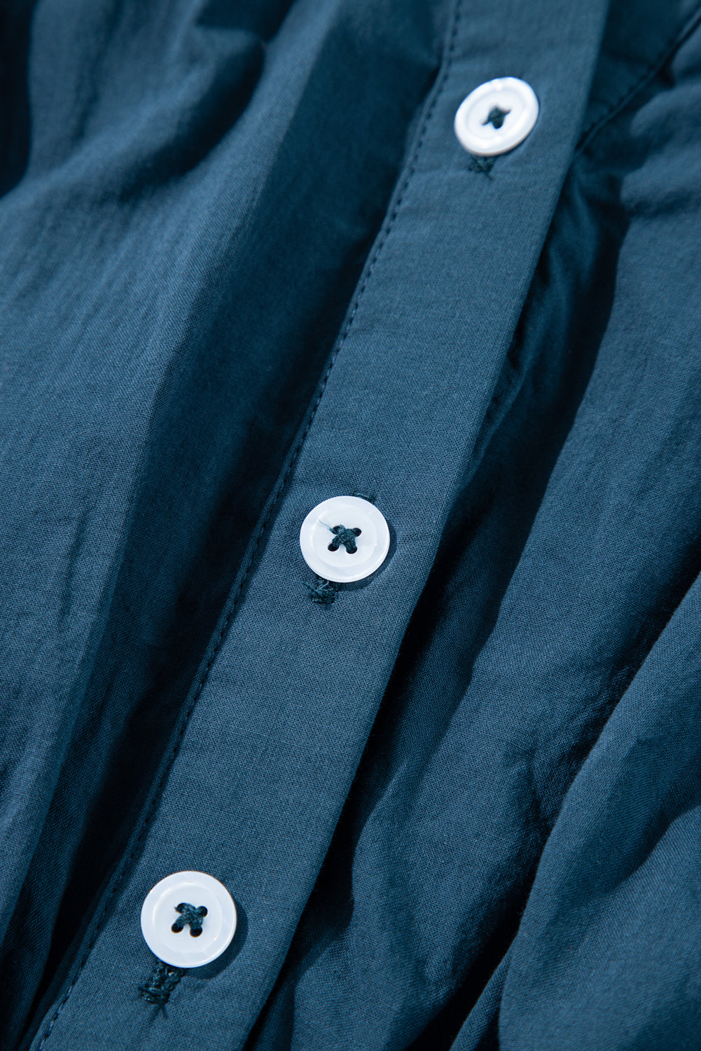 Prussian Blue 3/4 sleeve shirred high waist buttoned mini dress by Mommas Hive, made of 100% cotton, shown on a model.