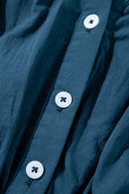 Prussian Blue 3/4 sleeve shirred high waist buttoned mini dress by Mommas Hive, made of 100% cotton, shown on a model.