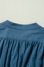 Prussian Blue Mommas Hive mini dress with 3/4 sleeves, shirred high waist, and button details, made of 100% cotton.