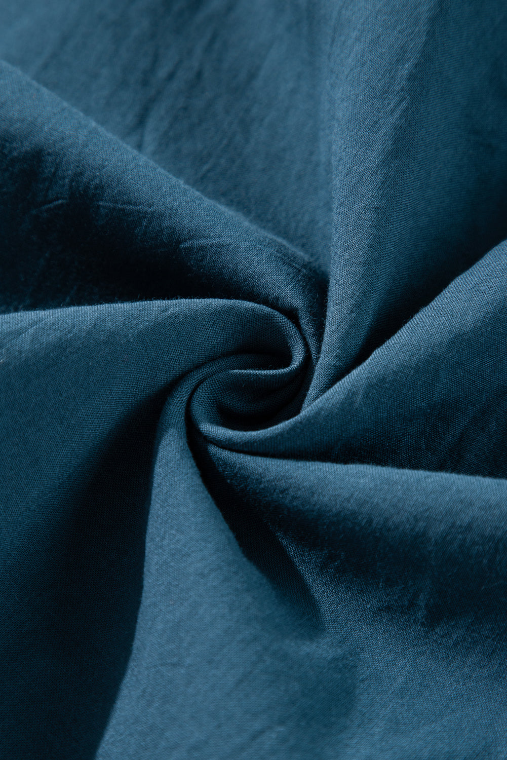 Mommas Hive Prussian Blue mini dress with 3/4 sleeves, shirred high waist, and button front, made of 100% cotton.